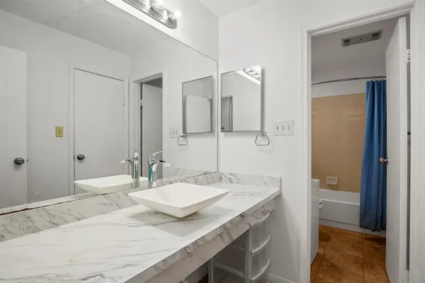 a bathroom with a toilet and a bathtub