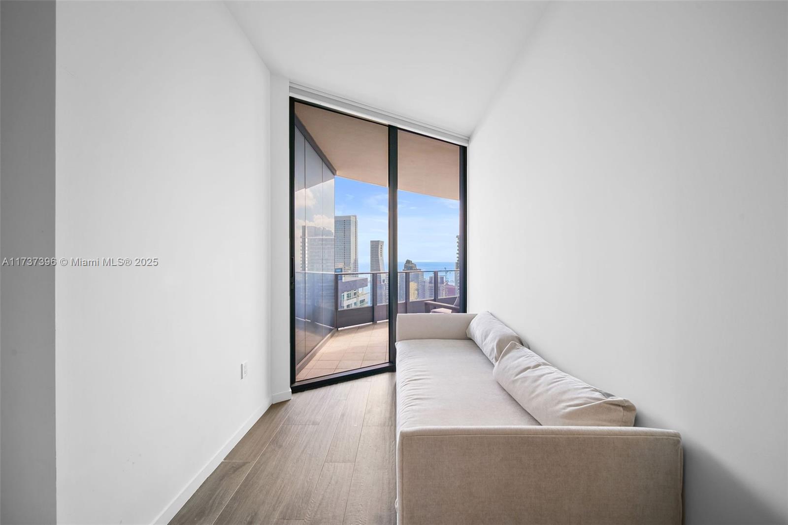 1000 Brickell Plaza, Unit PH5002 Miami, FL 33131 - Photo 35 of 68 a living room with furniture and a gate