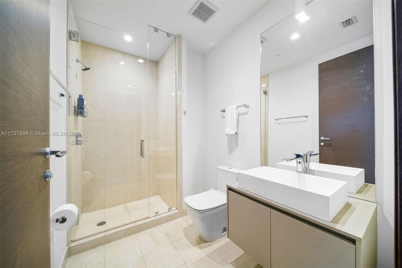 1000 Brickell Plaza, Unit PH5002 Miami, FL 33131 - Photo 41 of 68 a bathroom with a sink a toilet and shower