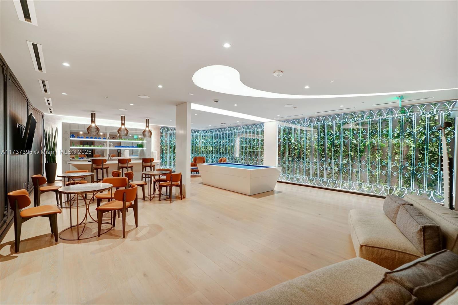 1000 Brickell Plaza, Unit PH5002 Miami, FL 33131 - Photo 50 of 68 a living room with furniture and a large window