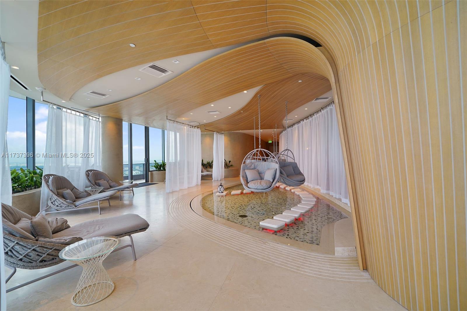 1000 Brickell Plaza, Unit PH5002 Miami, FL 33131 - Photo 53 of 68 a living room with furniture and a window