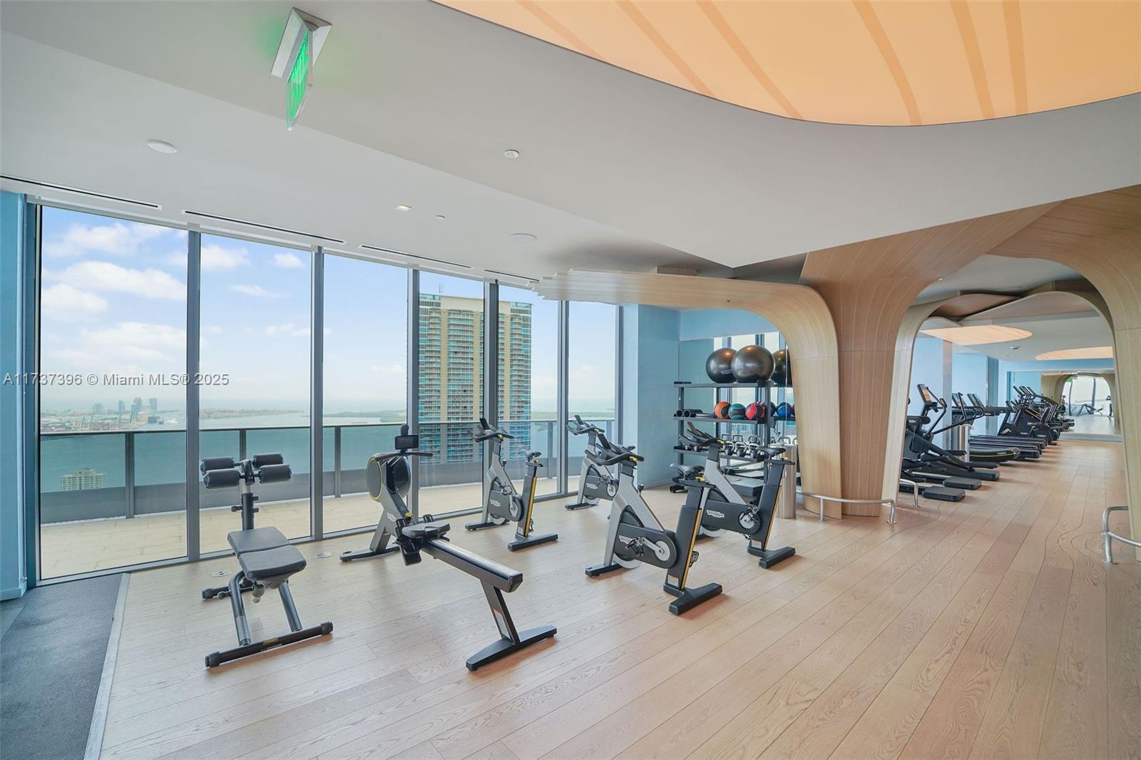 1000 Brickell Plaza, Unit PH5002 Miami, FL 33131 - Photo 59 of 68 a view of a room with gym equipment