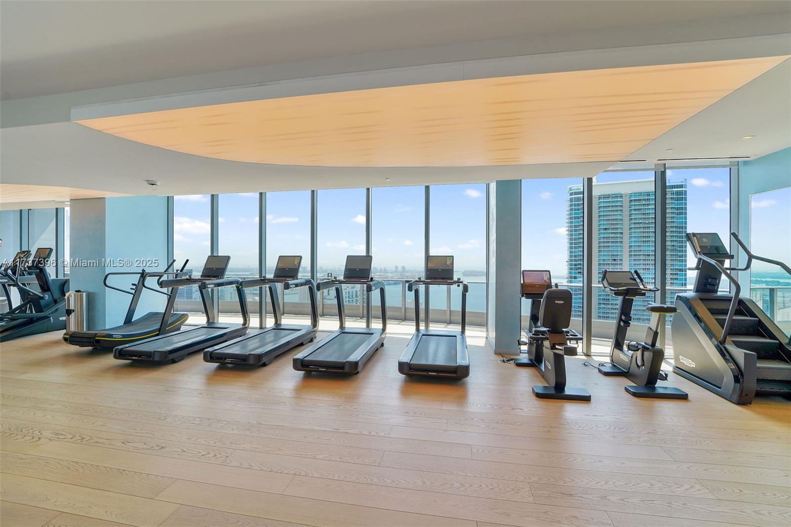 1000 Brickell Plaza, Unit PH5002 Miami, FL 33131 - Photo 61 of 68 a view of a room with gym equipment