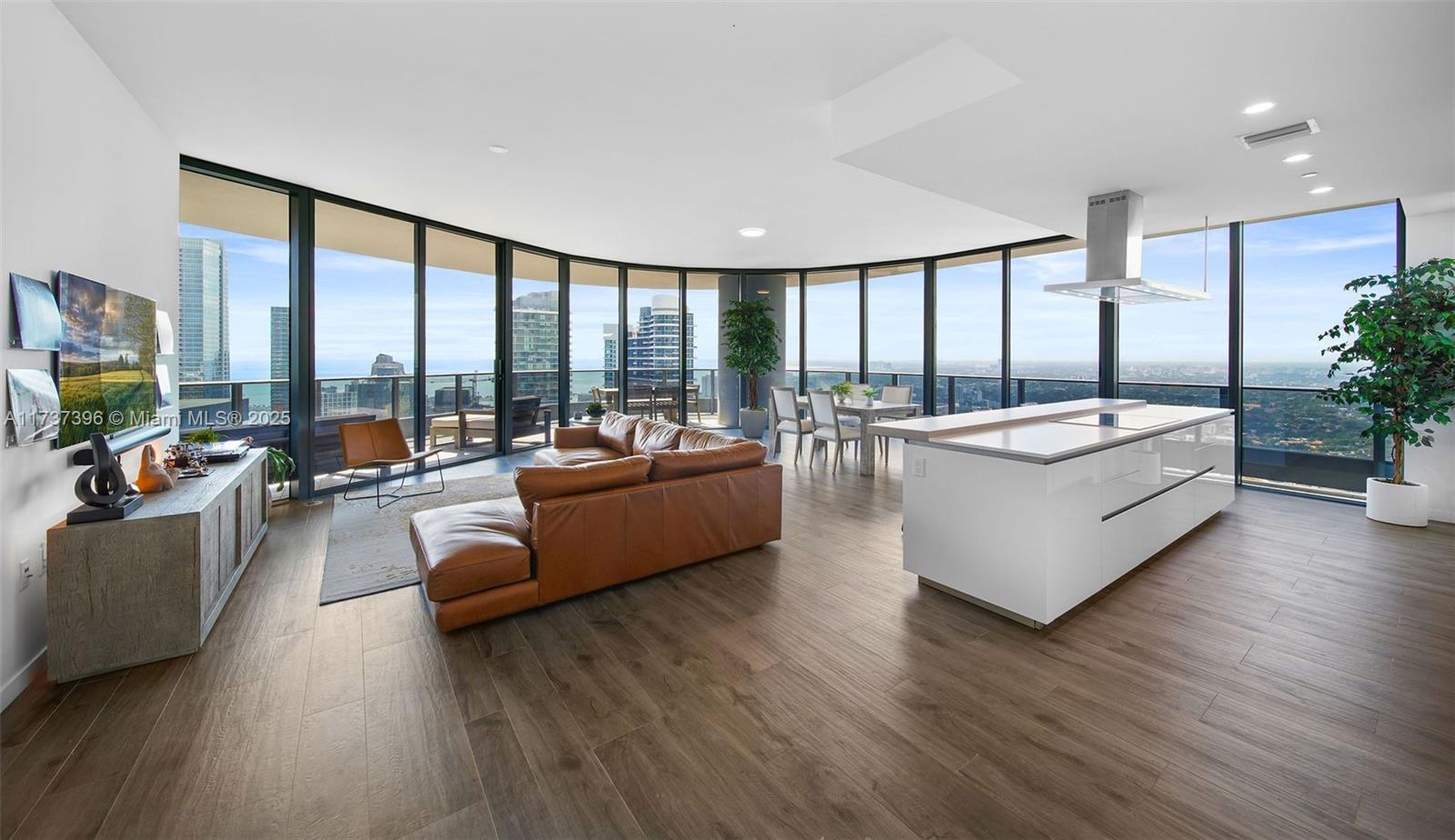 1000 Brickell Plaza, Unit PH5002 Miami, FL 33131 - Photo 8 of 68 a living room with furniture and a large window