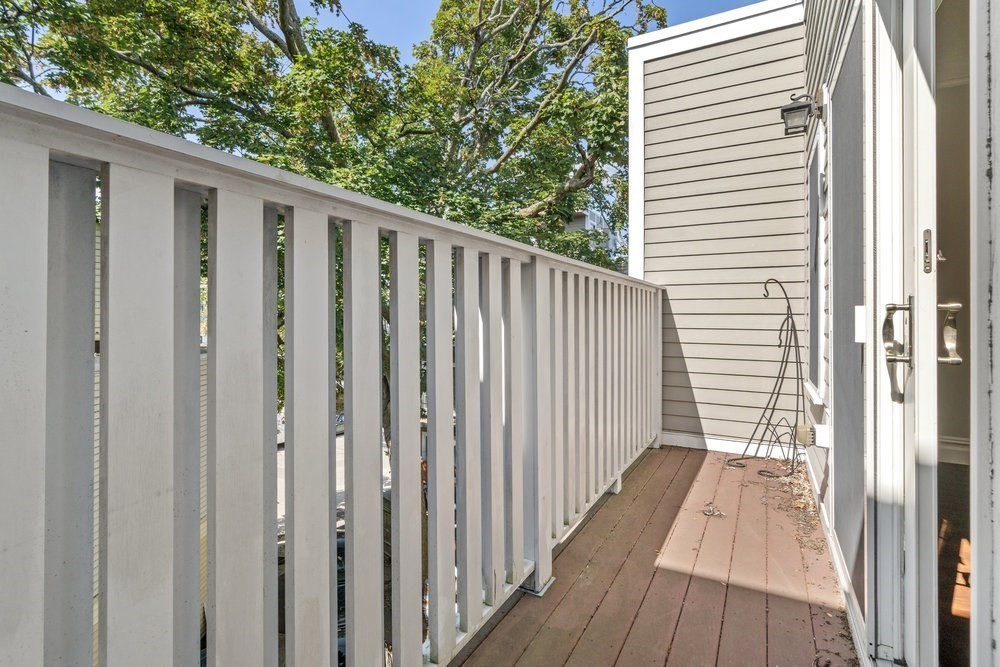 161 Tudor Street, Unit 4 Boston, MA 02127 - Photo 17 of 34 a view of a wooden door with a house