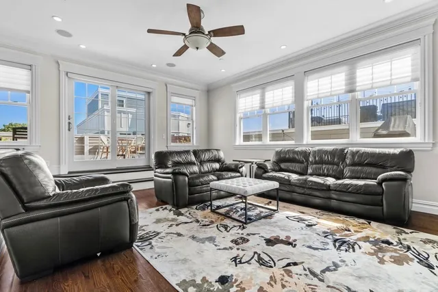 a living room with furniture and windows