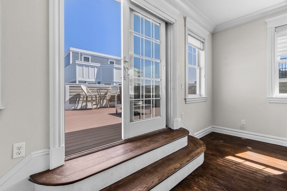 161 Tudor Street, Unit 4 Boston, MA 02127 - Photo 25 of 34 a bedroom with furniture and a window