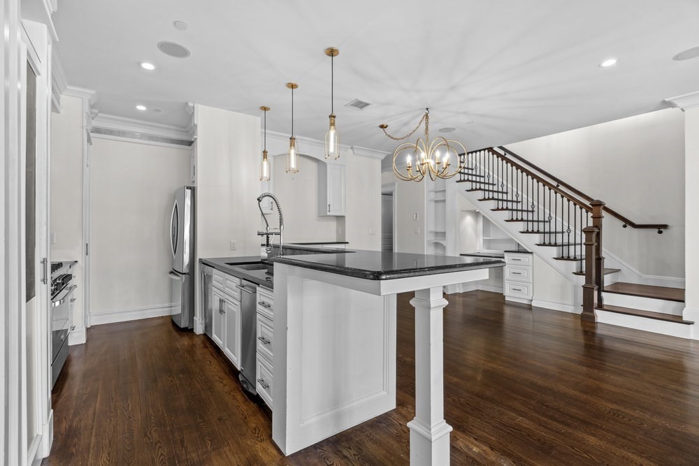 161 Tudor Street, Unit 4 Boston, MA 02127 - Photo 3 of 34 a kitchen with stainless steel appliances granite countertop a refrigerator a stove and a wooden floors