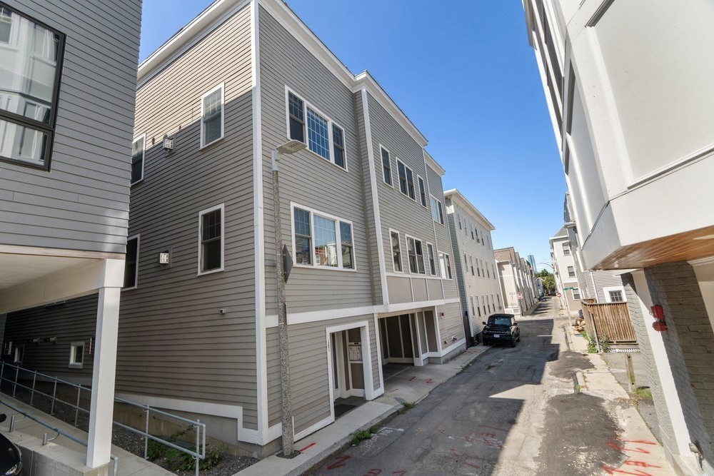 161 Tudor Street, Unit 4 Boston, MA 02127 - Photo 33 of 34 a view of a street with buildings