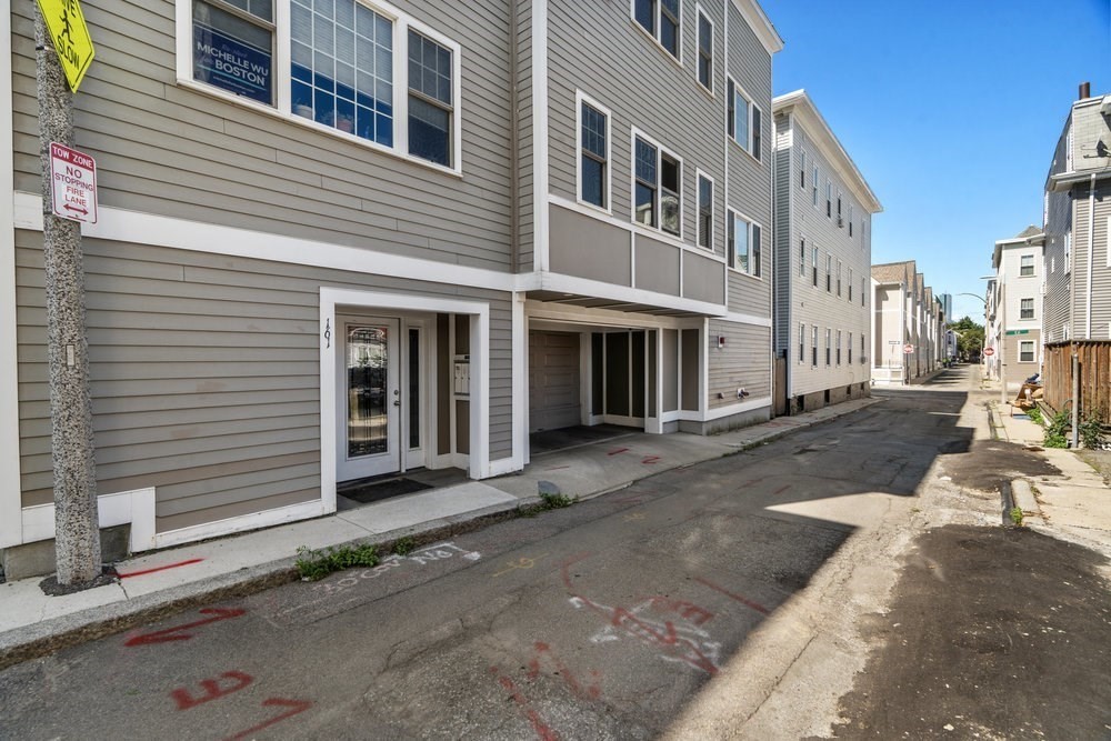 161 Tudor Street, Unit 4 Boston, MA 02127 - Photo 34 of 34 a front view of a house with a yard