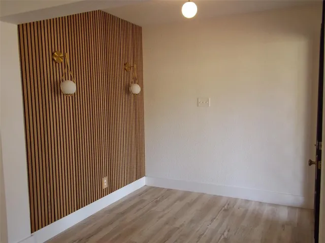 a view of wooden floor with entryway
