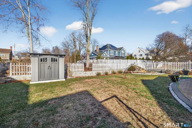 a view of a house with a yard porch and sitting area