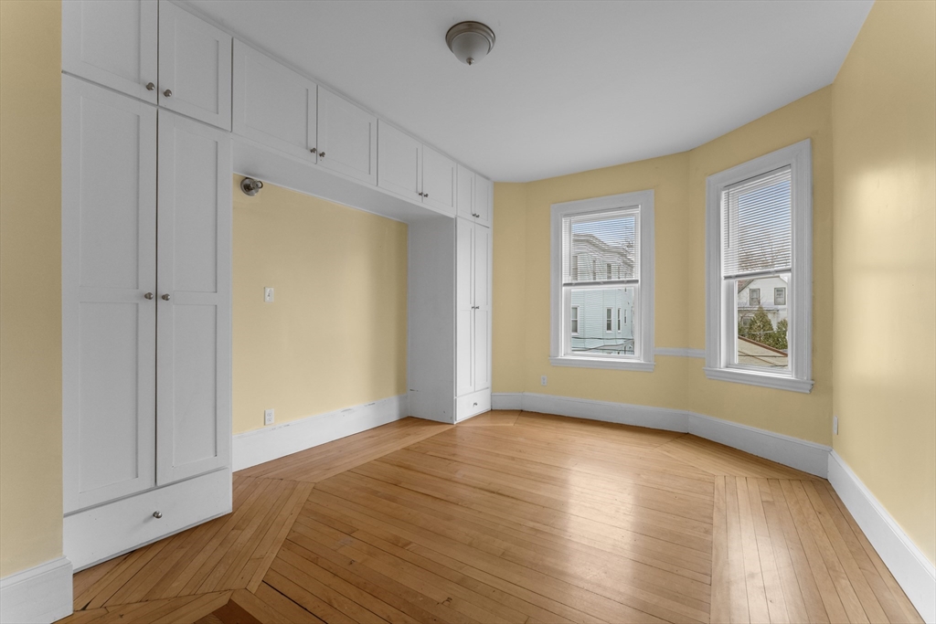 571 Washington Street, Unit 2 Boston, MA 02135 - Photo 8 of 13 a view of an empty room with window and closet area
