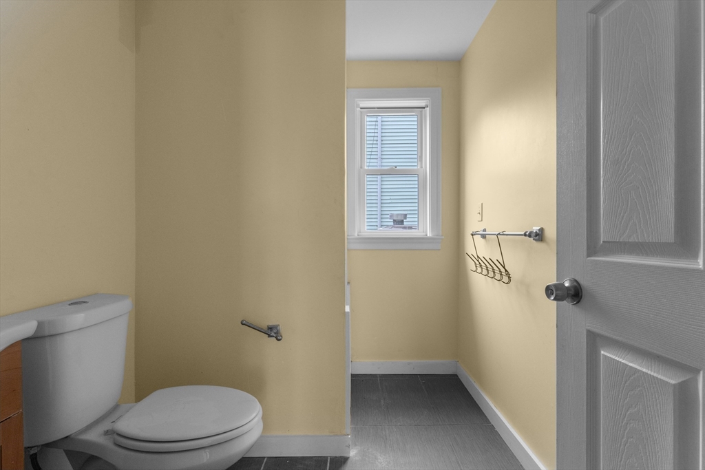 571 Washington Street, Unit 2 Boston, MA 02135 - Photo 10 of 13 a bathroom with a toilet
