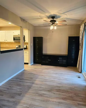 a view of an empty room with a window