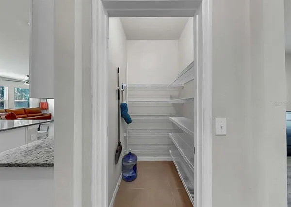 a kitchen with a sink cabinets and window