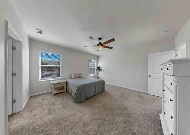a room with wooden floor and furniture