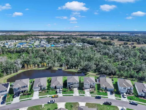a view of a lake with a yard