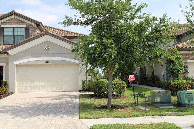 a view of a house with a yard and plants