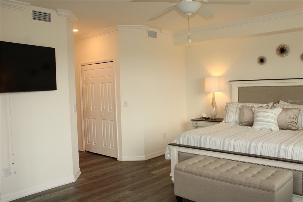 18017 Gawthrop Drive, Unit 104 Bradenton, FL 34211 - Photo 15 of 54 a room with a bed and a flat screen tv