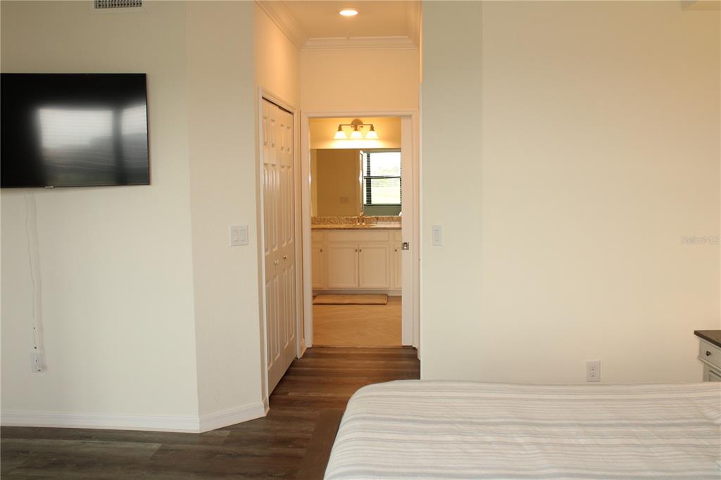 18017 Gawthrop Drive, Unit 104 Bradenton, FL 34211 - Photo 16 of 54 a view of a hallway with wooden floor
