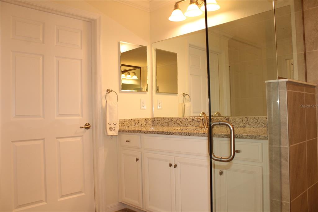 18017 Gawthrop Drive, Unit 104 Bradenton, FL 34211 - Photo 19 of 54 a bathroom with a shower and a sink