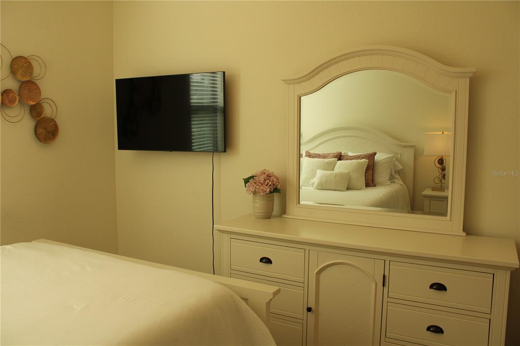 18017 Gawthrop Drive, Unit 104 Bradenton, FL 34211 - Photo 21 of 54 a bathroom with a sink and a mirror