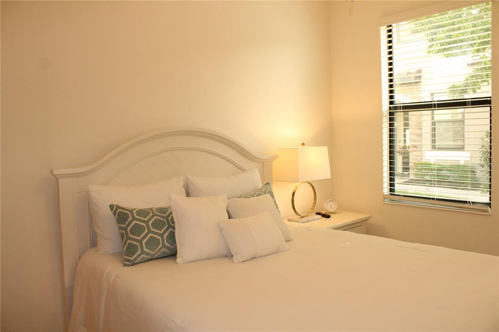 18017 Gawthrop Drive, Unit 104 Bradenton, FL 34211 - Photo 26 of 54 a large bed sitting in a bedroom next to a window