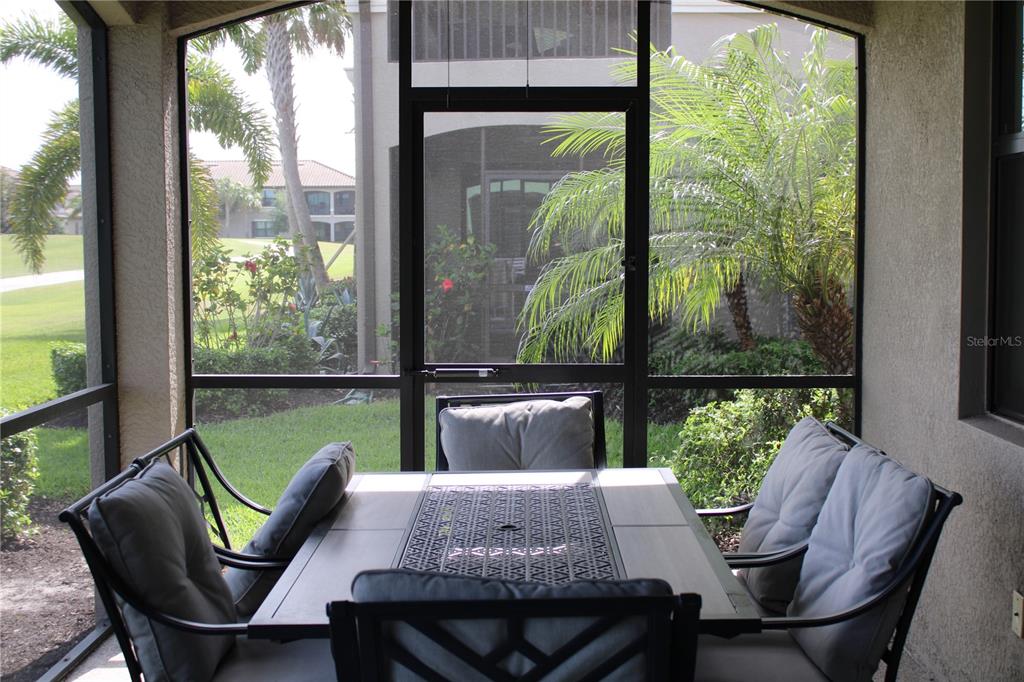 18017 Gawthrop Drive, Unit 104 Bradenton, FL 34211 - Photo 28 of 54 a view of a dining room with furniture window and outside view