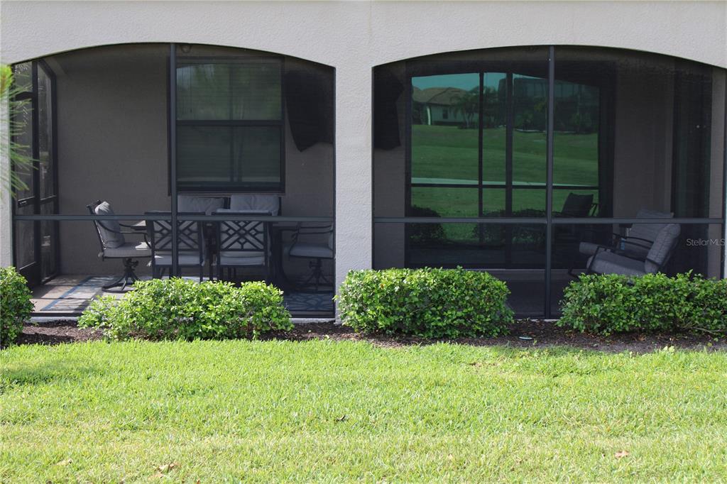 18017 Gawthrop Drive, Unit 104 Bradenton, FL 34211 - Photo 36 of 54 a front view of a house with garden