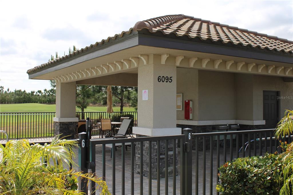 18017 Gawthrop Drive, Unit 104 Bradenton, FL 34211 - Photo 39 of 54 a front view of a house with a garden