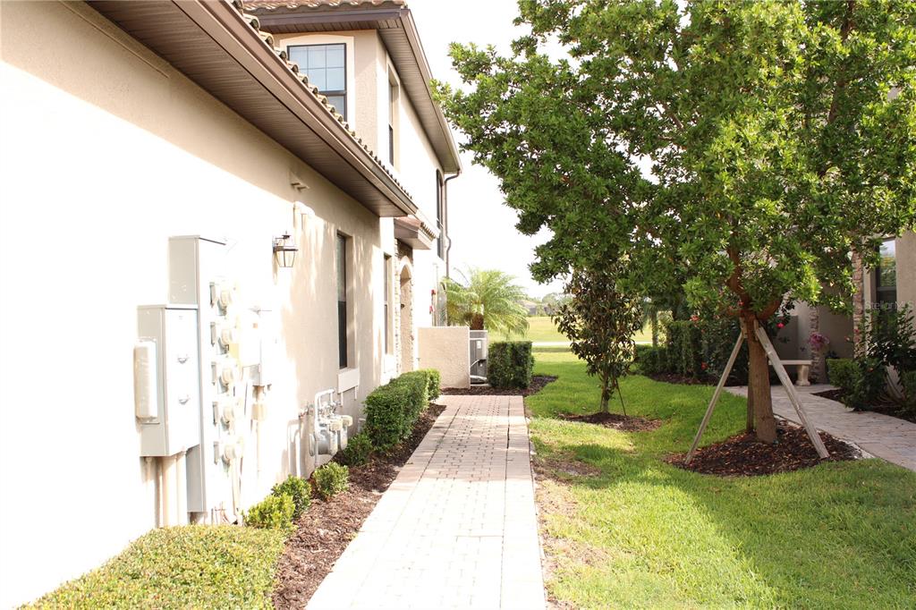 18017 Gawthrop Drive, Unit 104 Bradenton, FL 34211 - Photo 40 of 54 a view of a house with backyard and trees