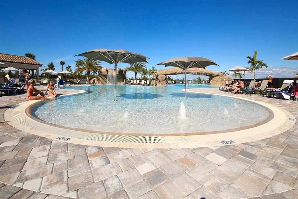 18017 Gawthrop Drive, Unit 104 Bradenton, FL 34211 - Photo 48 of 54 a view of a swimming pool with outdoor seating