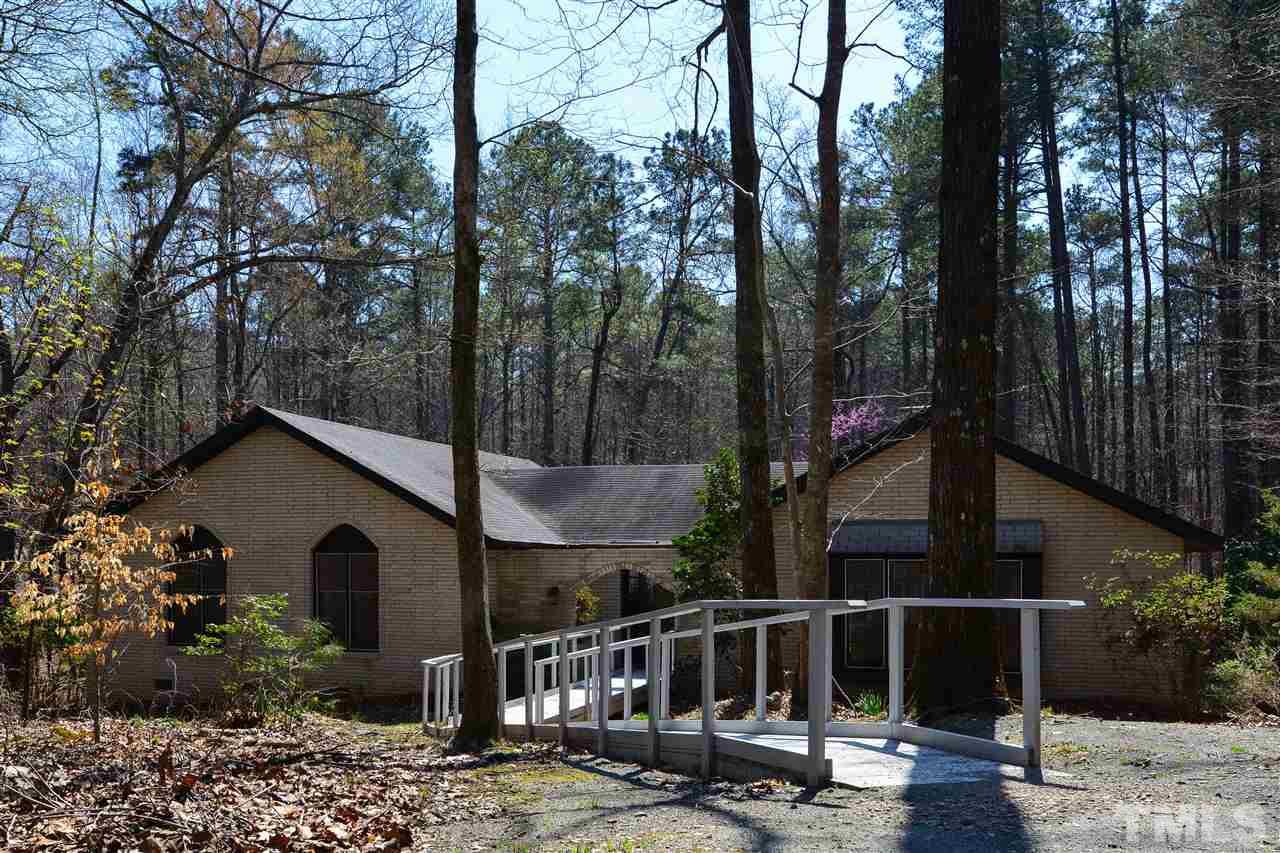 6712 Laurdane Road Raleigh, NC 27613 - Photo 1 of 25 a view of house with backyard and sitting area