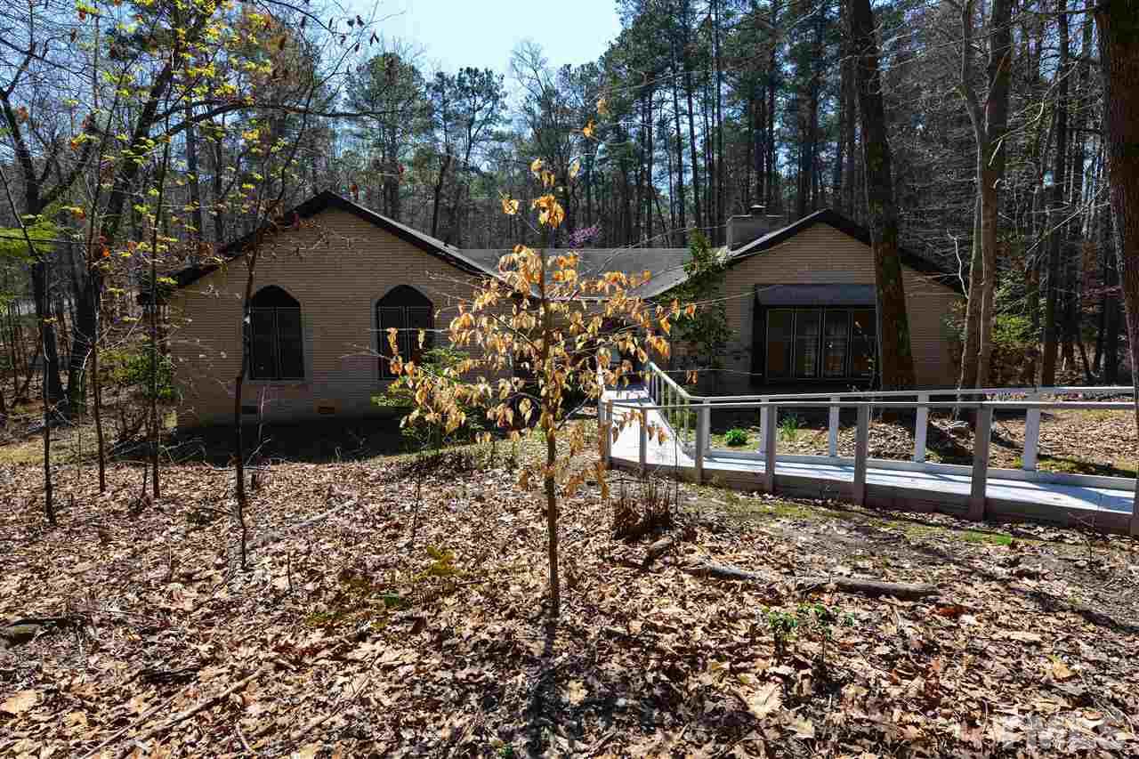 6712 Laurdane Road Raleigh, NC 27613 - Photo 2 of 25 a house with trees in the background