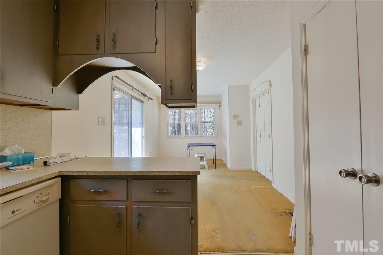 6712 Laurdane Road Raleigh, NC 27613 - Photo 13 of 25 a kitchen with a sink and cabinets