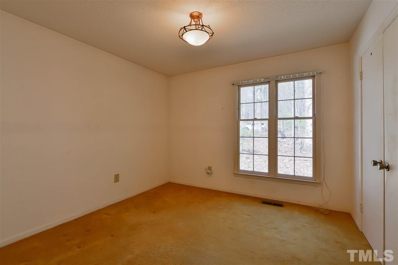 6712 Laurdane Road Raleigh, NC 27613 - Photo 15 of 25 an empty room with a window