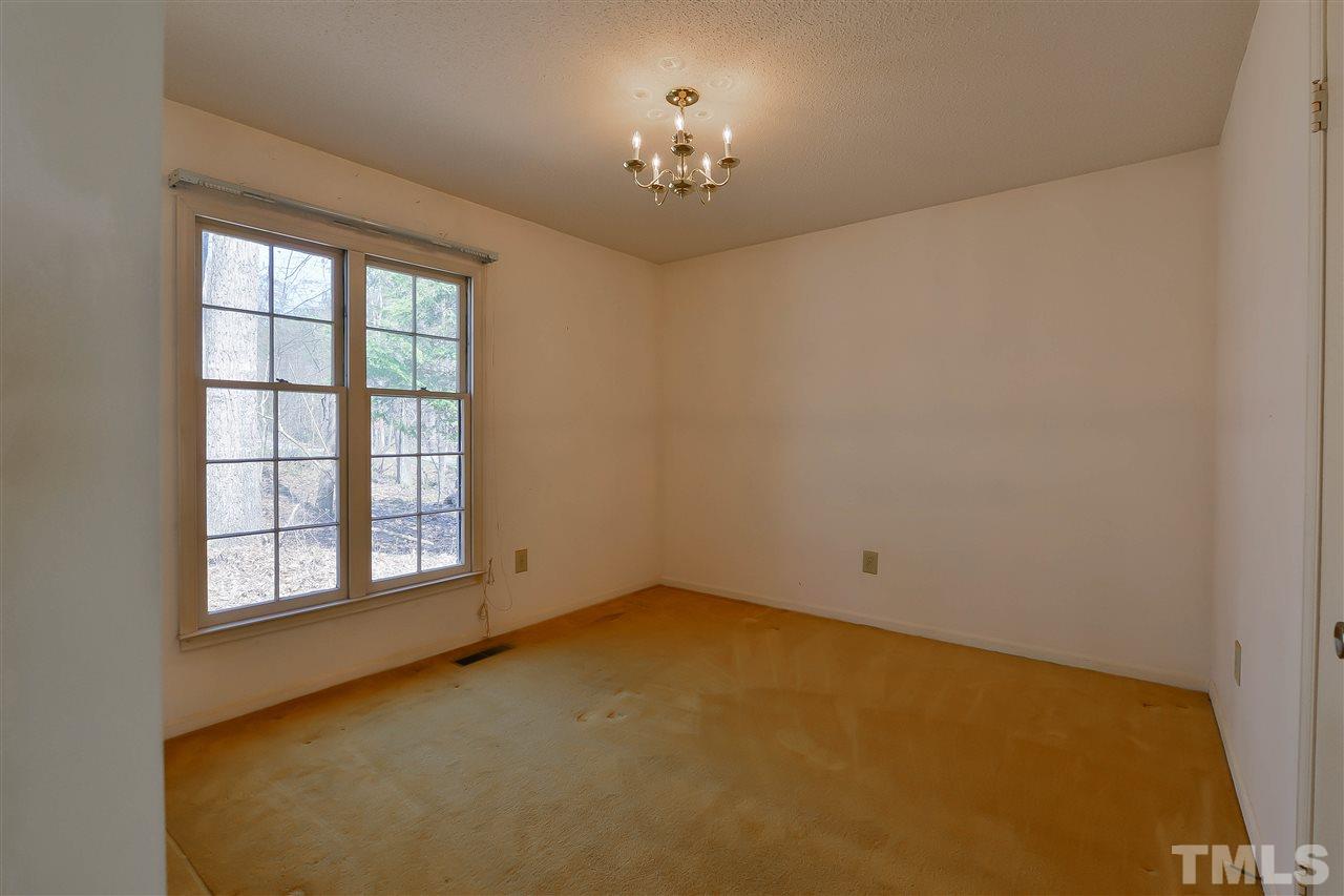 6712 Laurdane Road Raleigh, NC 27613 - Photo 16 of 25 an empty room with a empty space and a window