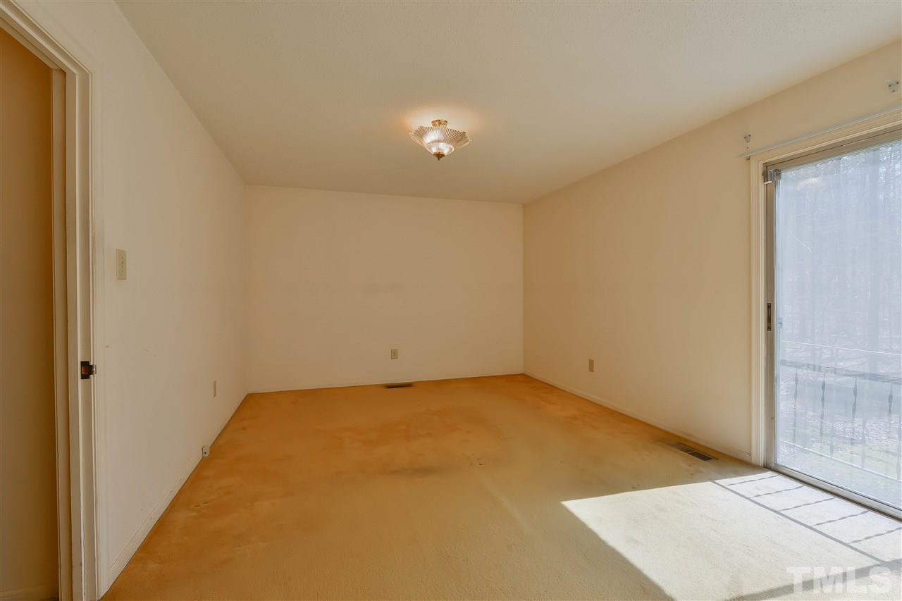 6712 Laurdane Road Raleigh, NC 27613 - Photo 19 of 25 an empty room with a door