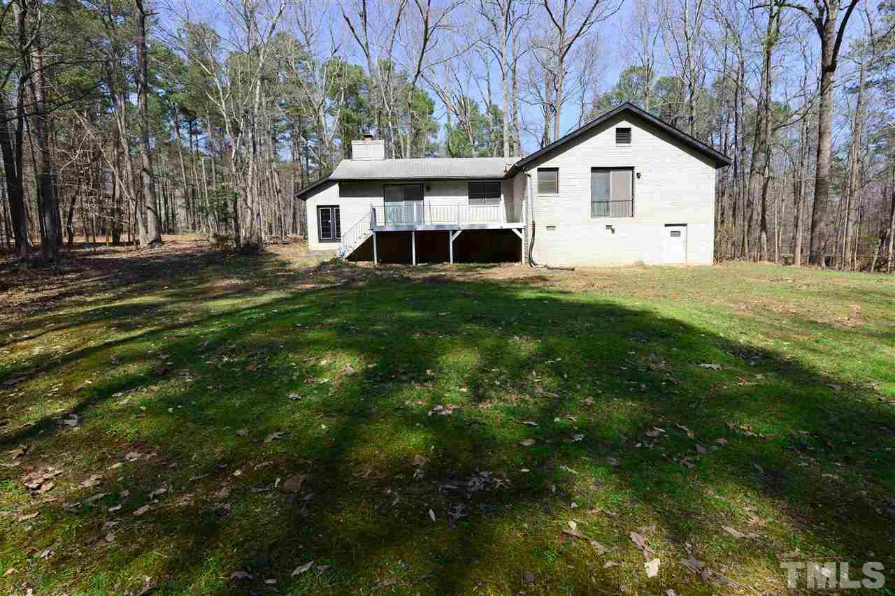 6712 Laurdane Road Raleigh, NC 27613 - Photo 25 of 25 a view of a yard in front of a house with large trees