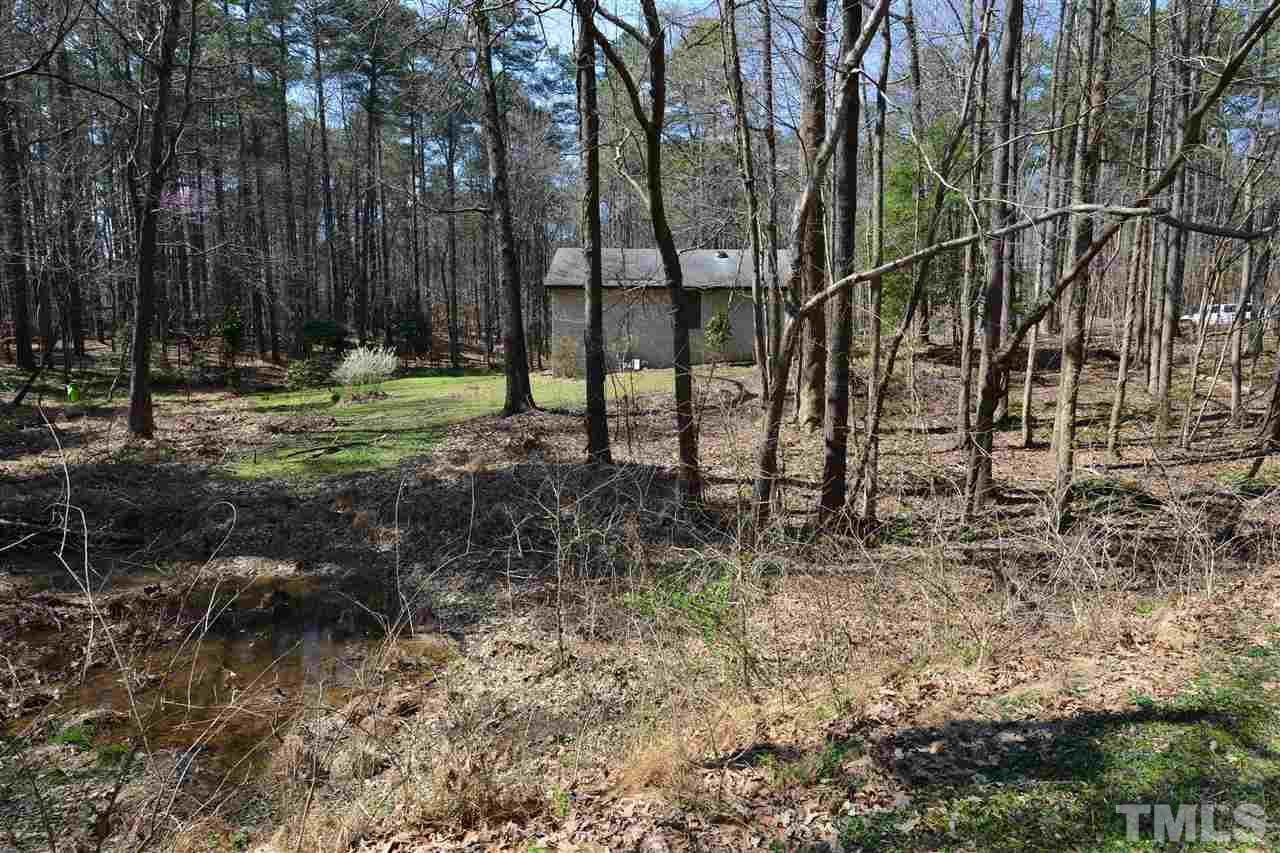 6712 Laurdane Road Raleigh, NC 27613 - Photo 4 of 25 a view of outdoor space with trees