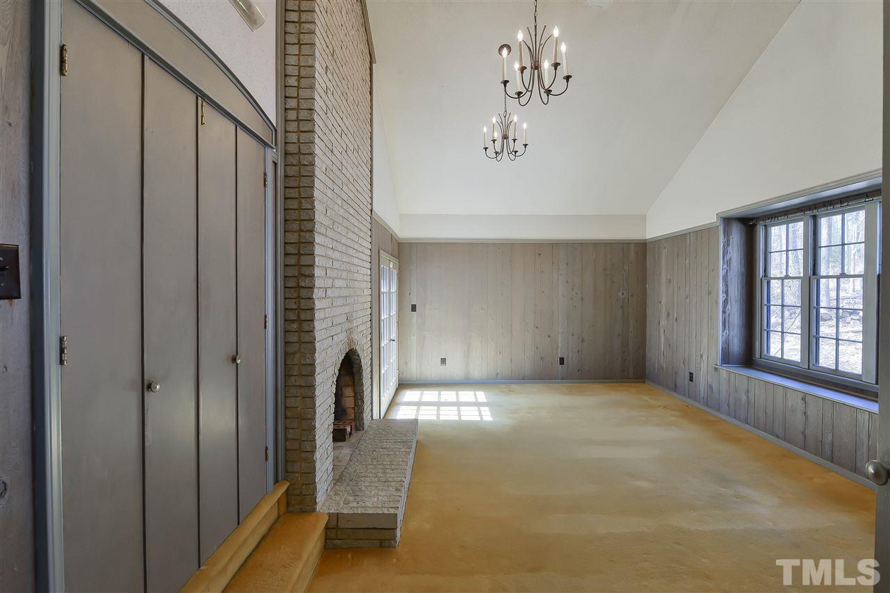 6712 Laurdane Road Raleigh, NC 27613 - Photo 5 of 25 a view of a livingroom with a fireplace