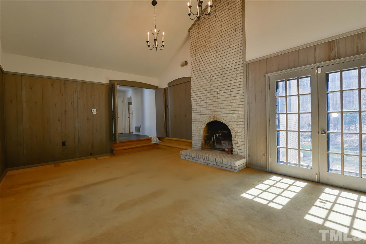 6712 Laurdane Road Raleigh, NC 27613 - Photo 8 of 25 a view of livingroom with couch and window