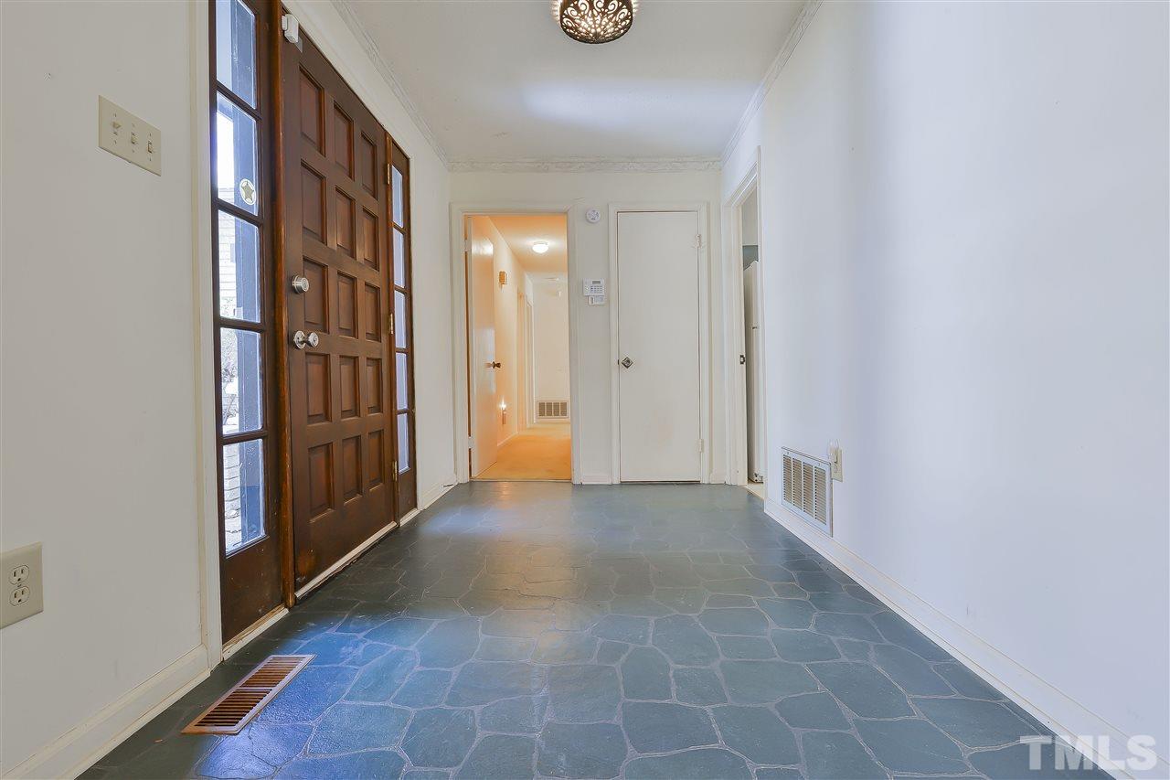 6712 Laurdane Road Raleigh, NC 27613 - Photo 9 of 25 a view of a hallway with entryway door