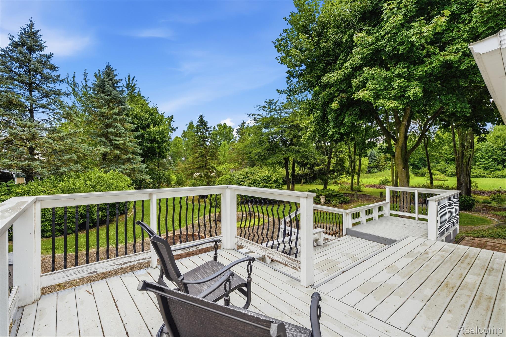 13182 Gilbert Road Memphis, MI 48041 - Photo 40 of 48 Spacious outdoor deck featuring painted wood flooring and white railing with black balusters