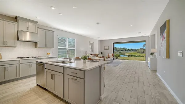 a living room with furniture large window with garden view