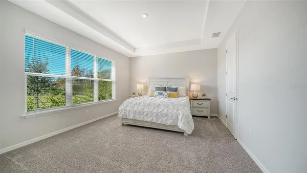a view of a white cabinet and wooden floor in a room