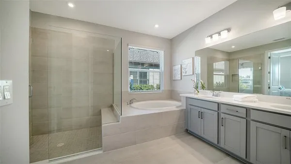 a view of a lake with houses in the back