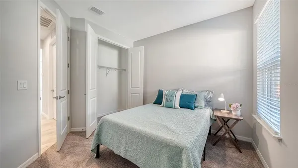 a view of a livingroom with furniture wooden floor and a rug