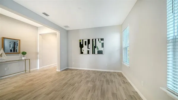 a view of a pathway with a garden